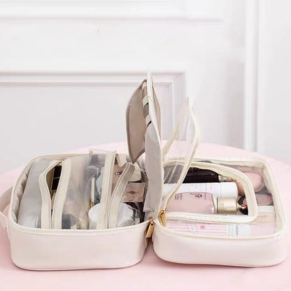 Cosmetic bag with transparent compartments
