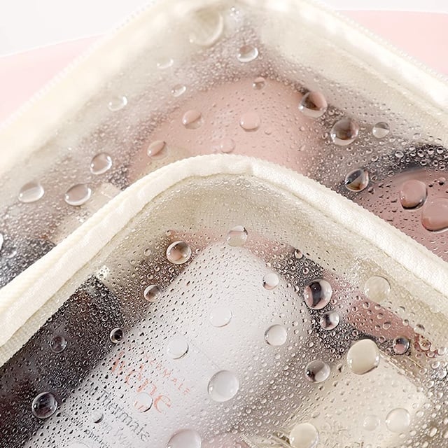 Cosmetic bag with transparent compartments