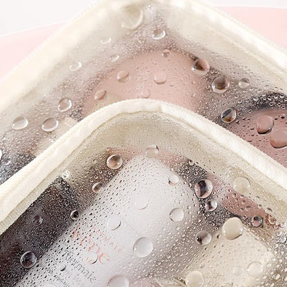 Cosmetic bag with transparent compartments