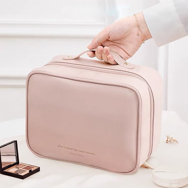 Cosmetic bag with transparent compartments