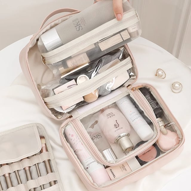 Cosmetic bag with transparent compartments